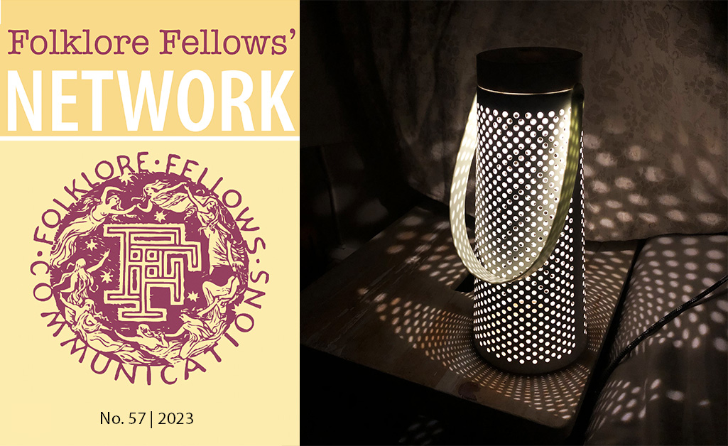 Header image. On the left, the red Folklore Fellows' Network logo on a yellow background, on the right, a white, modern lantern throwing circular reflections of light into a dark room.